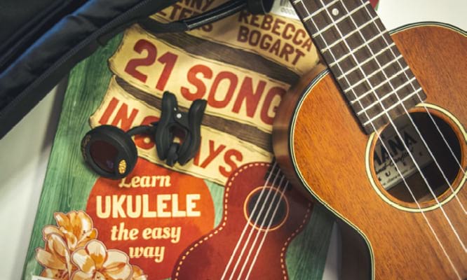 A ukulele and book